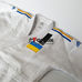 Кимоно для дзюдо Adidas Champion 2 с аккредитацией IJF национальный флаг SlimFit (J-IJFS-SMU, белое)